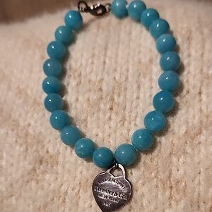 Tiffany & Co. Blue Bracelet with Smooth Beads and Silver Charm